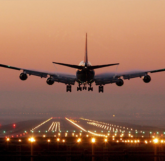 Close up view of an Aero plane landed on the ground at sunset